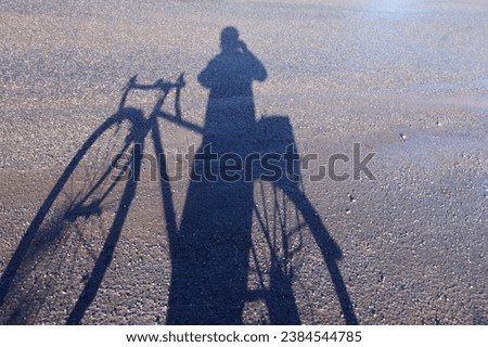 Similar – Image, Stock Photo shadow of cyclist taking photo