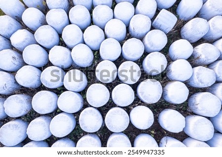 Similar – Image, Stock Photo Packed bales of straw on a meadow