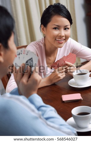 Similar – Image, Stock Photo Delighted ethnic couple playing video game together