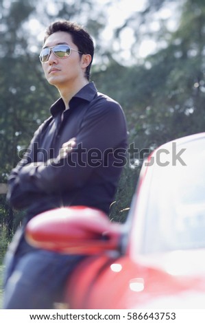 Similar – Image, Stock Photo Contemplative Asian man leaning on hand against brick building