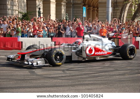 BUDAPEST, HUNGARY-  MAY 1: F1 driver Jenson Button does some burnouts for his fans on May 1, 2012 on streets in Budapest.