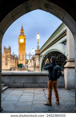 Similar – Image, Stock Photo Man shooting building facade with smartphone in downtown