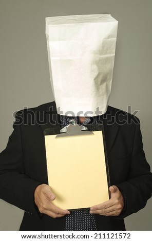 Businessman with a white paper bag over his head