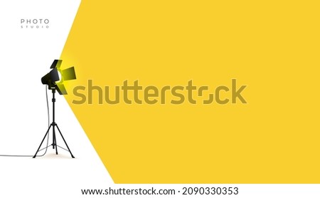 Photo studio lamp. Spotlight concept. Spotlight shines with yellow light from the left side. Place for text for your design. Vector illustration photo studio flashes light bulb icon.