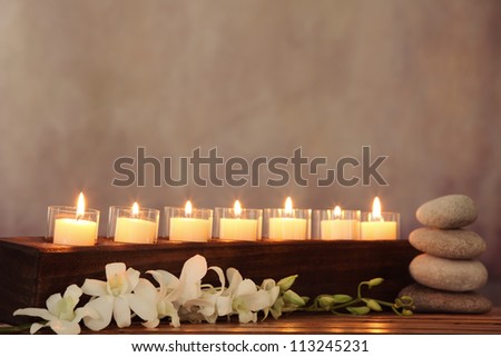 Burning candles,orchid flower and zen stone,zen concept.