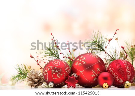 Closeup of red Christmas balls and fir branch on white  background.