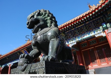 copper lion in front of an ancient architecture in summer palace of Beijing,China.