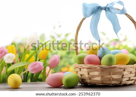 Basket of easter eggs with flowers