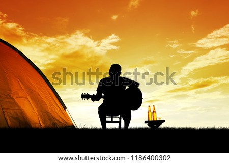 Similar – Image, Stock Photo Musician holding guitar at seaside