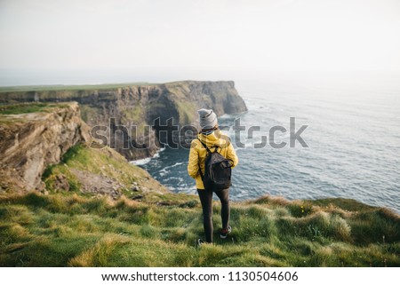 Similar – Image, Stock Photo Female standing on cliff and contemplating