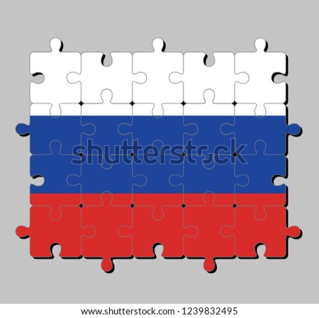 Jigsaw puzzle of Russia flag in a tricolor flag consisting of three equal horizontal fields: white  blue  and red. Concept of Fulfillment or perfection.