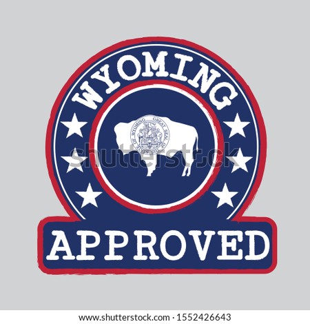 Vector Stamp of Approved logo with Wyoming Flag in the round shape on the center. The states of America. Grunge Rubber Texture Stamp of Approved from Wyoming.