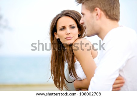 Portrait of an attractive woman seriously listening to her boyfriend while on a date