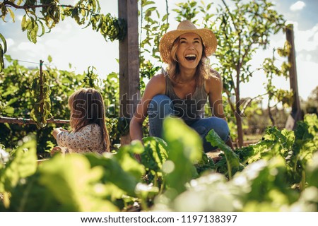 Image, Stock Photo Two little girls gardening in urban community garden