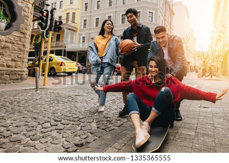 Similar – Image, Stock Photo Playful trendy young ethnic woman in deserted countryside