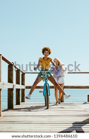 Similar – Image, Stock Photo Ethnic woman with bicycle on street