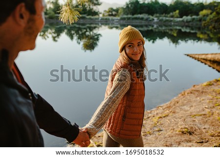 Similar – Image, Stock Photo Traveling couple near lake in forest