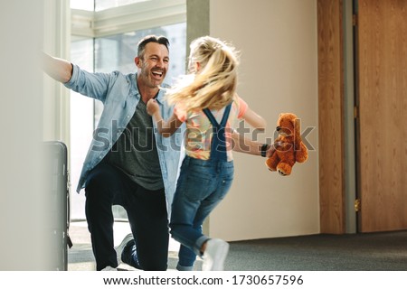 Similar – Image, Stock Photo Girl running towards the sea on the beach of the Baltic Sea with a yellow swimming ring on her back