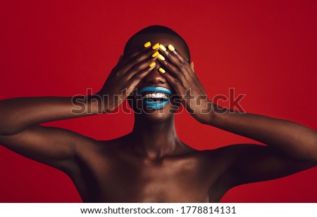 Similar – Image, Stock Photo Cheerful black woman covering eye