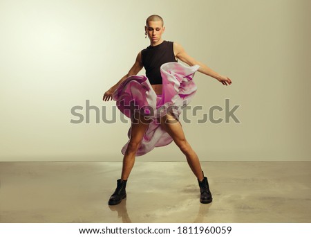 Similar – Image, Stock Photo Eccentric androgynous man in black outfit