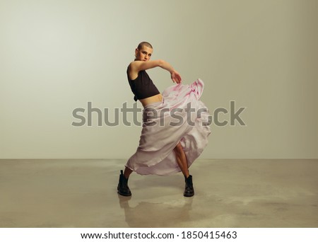 Similar – Image, Stock Photo Eccentric androgynous man in black outfit