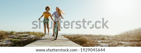 Similar – Foto Bild mit dem fahrrad am strand