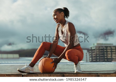 Similar – Image, Stock Photo Tired sportswoman with basketball ball resting on court