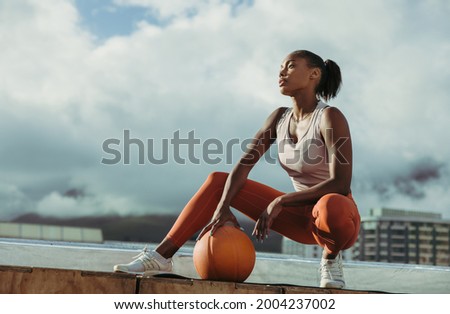 Similar – Image, Stock Photo Tired sportswoman with basketball ball resting on court