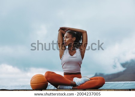 Similar – Image, Stock Photo Tired sportswoman with basketball ball resting on court