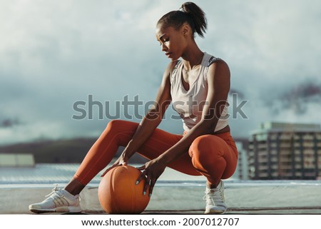 Similar – Image, Stock Photo Tired sportswoman with basketball ball resting on court