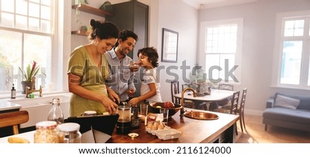 Similar – Image, Stock Photo Two slice of home made organic sourdough bread slice with butter and raspberry jam on a wooden chopping board with spoon and loaf of bread and napkin. Healthy breakfast idea for vegetarians