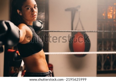 Similar – Image, Stock Photo Thoughtful young female athlete listening to music in studio