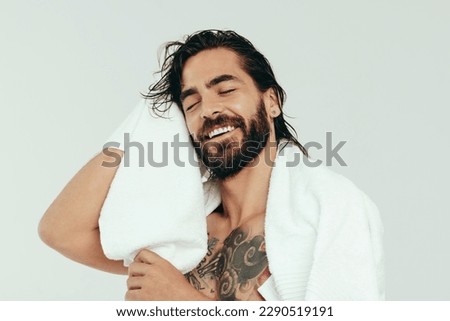 Similar – Image, Stock Photo Young man taking care of his plants on a balcony