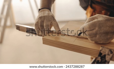 Similar – Image, Stock Photo Focused male carpenter working with wood in workshop
