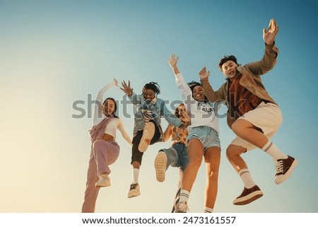 Similar – Image, Stock Photo Group of friends jumping and tossing ball up