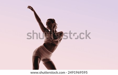 Similar – Image, Stock Photo Graceful ballerina and her male partner dancing elements of classical or modern ballet in dark with floodlight backlight. Couple in smoke on black background. Art concept.