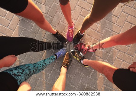 Similar – Image, Stock Photo Group of female athletes performing Supported Headstand IV yoga asana