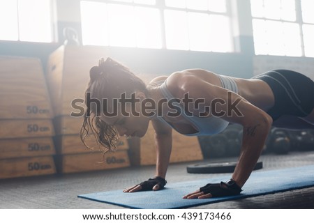 Similar – Image, Stock Photo Female athlete doing push-ups outdoors