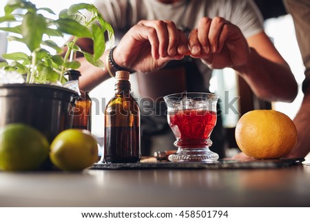 Image, Stock Photo Crop barman putting leaf on cocktail