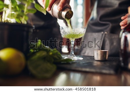 Similar – Image, Stock Photo Crop barman preparing cocktail at counter