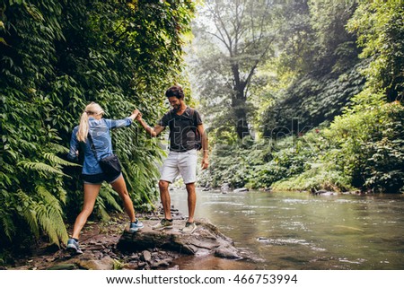 Similar – Image, Stock Photo cross a stream with hiking boots