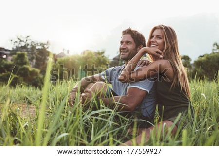Similar – Image, Stock Photo Young, tall, smiling woman in front of red wall