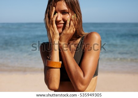 Similar – Image, Stock Photo Smiling women in swimsuits on sandy beach near ocean