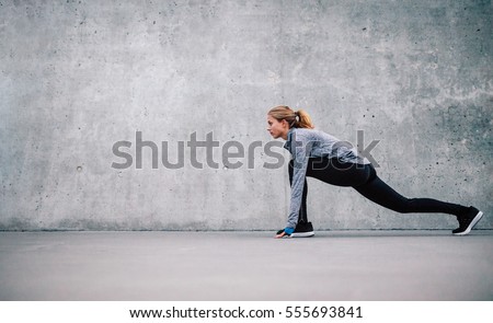 Similar – Image, Stock Photo Young athletic woman exercising at the gym.