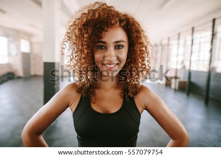 Similar – Image, Stock Photo Afro athlete woman standing outdoors.