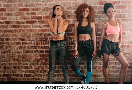 Similar – Image, Stock Photo Fit woman standing against sea during workout