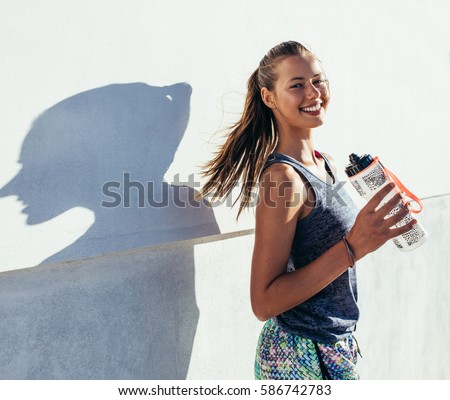 Similar – Foto Bild Junge Frau mit Sportbekleidung und Springseil