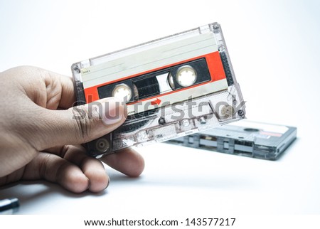 vintage image of holding audio tape cassettes