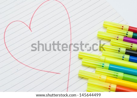 heart shape drawn on scribble pad using color sketch pens