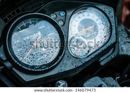 motor bike odometer  fuel meter tachometer and ignition with dew droplets